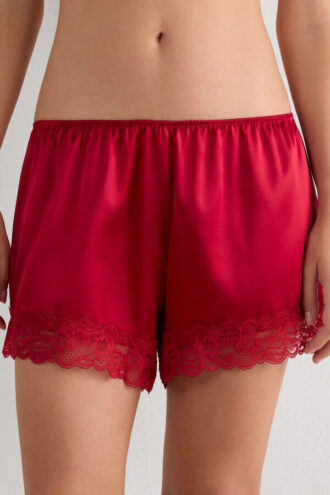 Shorts in seta con bordi in pizzo