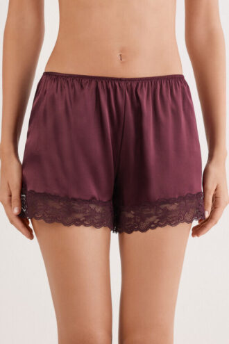 Shorts in seta con bordi in pizzo
